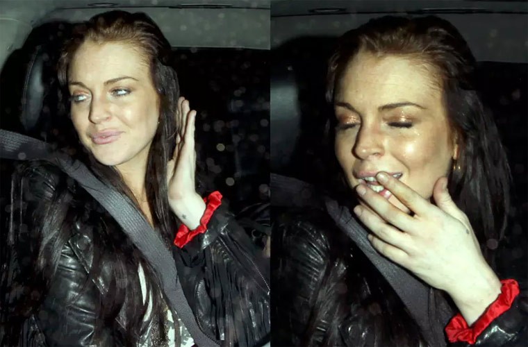  Lindsay Lohan mắt nhắm nghiền, say ngất ngư khi bước ra ừ quán bar lúc 2h sáng. (Ảnh: celebitchy.com)